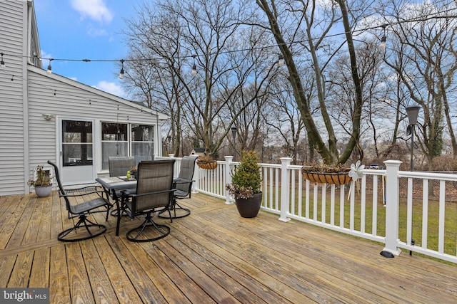 wooden deck featuring a sunroom