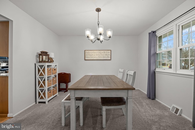 unfurnished dining area featuring carpet floors and a notable chandelier