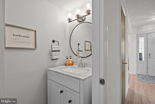 bathroom featuring hardwood / wood-style flooring and vanity