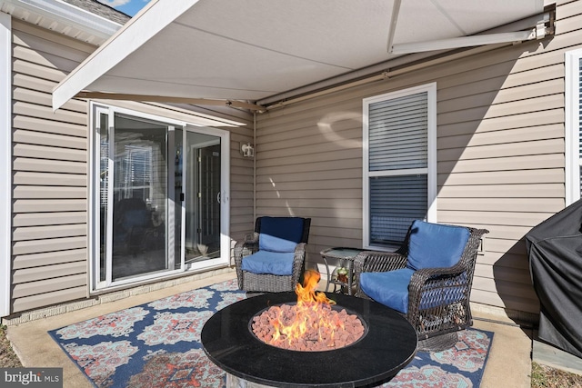 view of patio / terrace featuring a fire pit