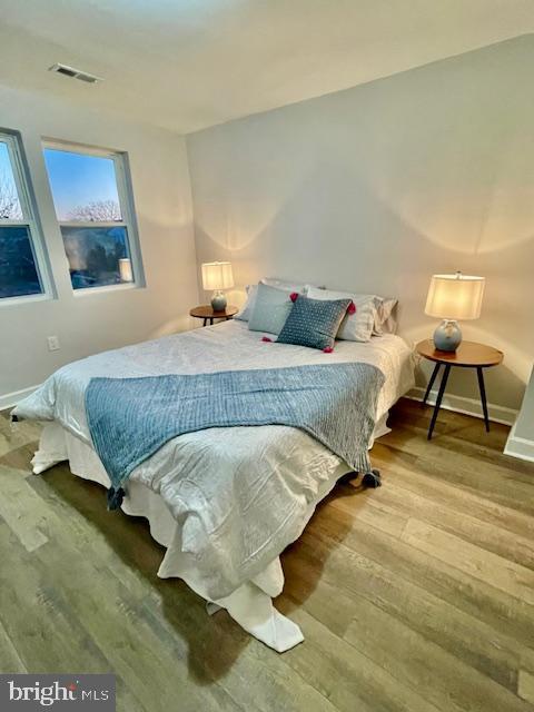 bedroom featuring wood-type flooring