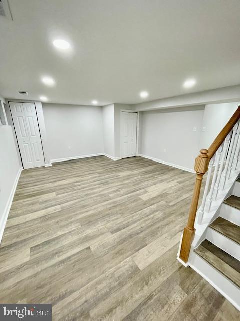 basement featuring hardwood / wood-style floors