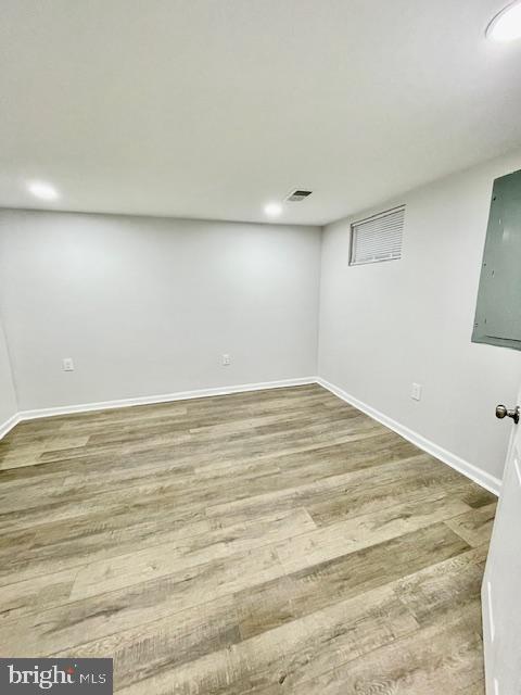 basement with wood-type flooring