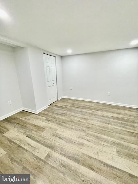 basement featuring hardwood / wood-style floors