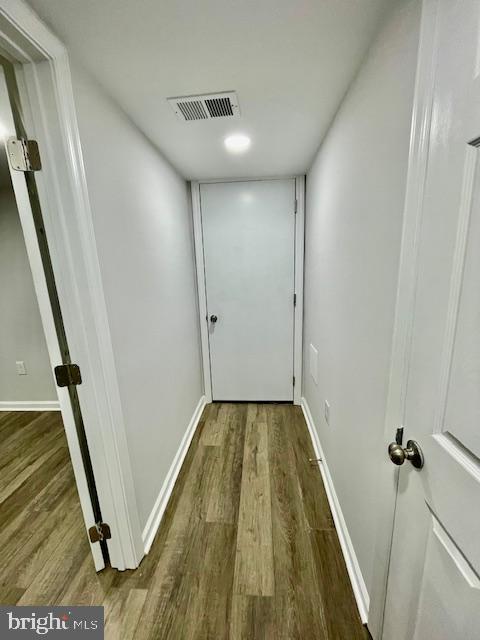 hallway featuring hardwood / wood-style floors