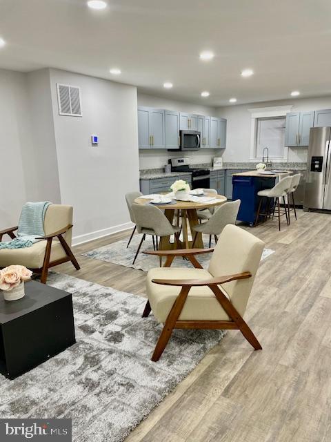 dining room featuring light hardwood / wood-style flooring