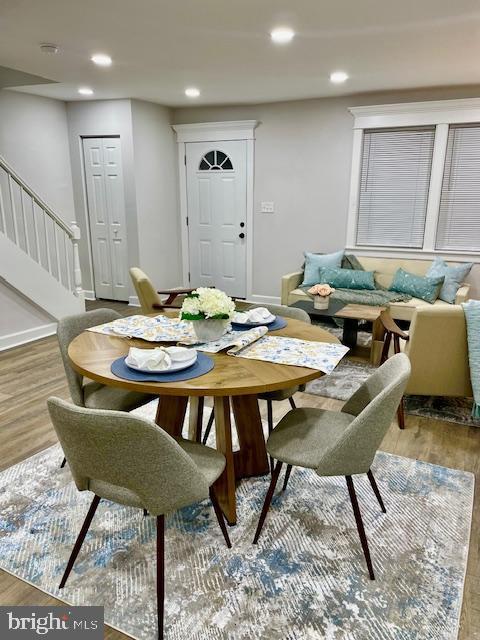 dining area with wood-type flooring