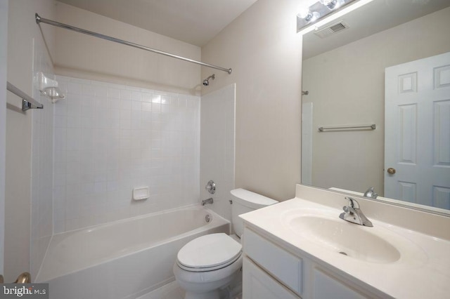 full bathroom featuring vanity, washtub / shower combination, and toilet