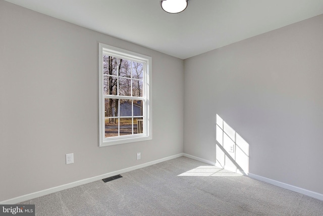 empty room featuring light colored carpet