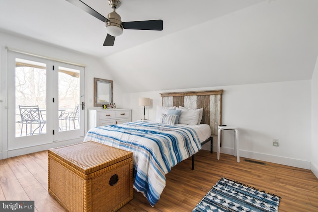 bedroom featuring vaulted ceiling, access to outside, ceiling fan, and light hardwood / wood-style floors