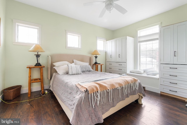 bedroom featuring ceiling fan and dark hardwood / wood-style floors