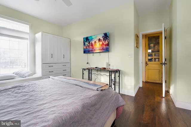 bedroom featuring dark wood-type flooring and ceiling fan