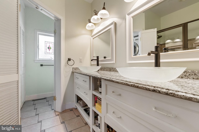 bathroom with vanity, tile patterned floors, and walk in shower