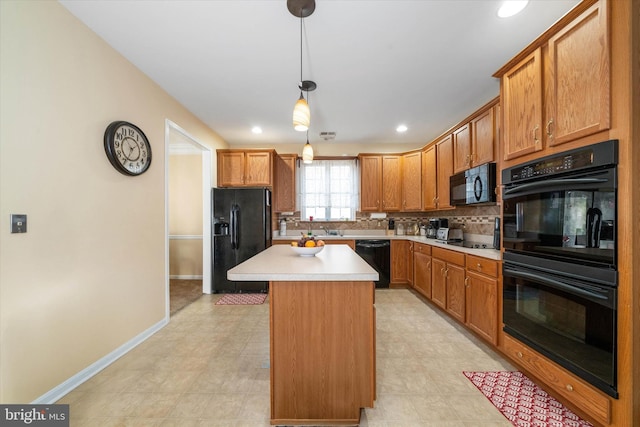 kitchen featuring sink, a center island, tasteful backsplash, black appliances, and decorative light fixtures