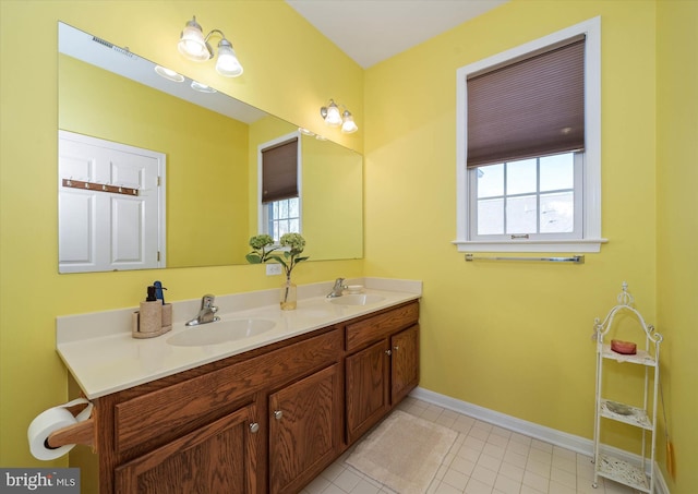 bathroom with vanity and tile patterned floors