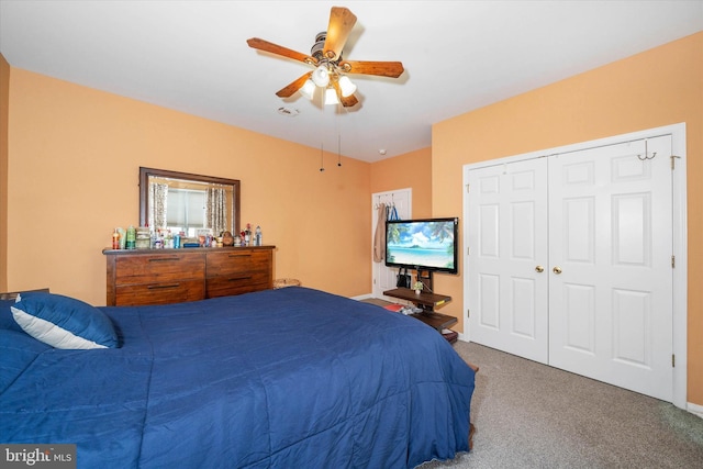 bedroom with carpet floors, a closet, and ceiling fan