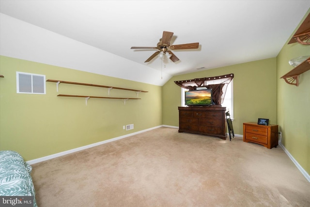 unfurnished bedroom featuring ceiling fan, lofted ceiling, and light carpet