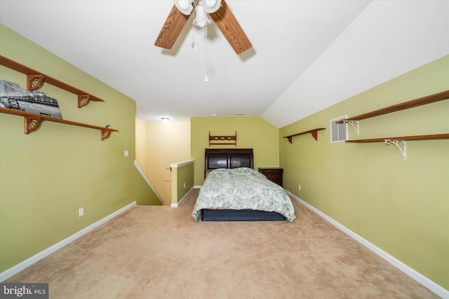 unfurnished bedroom with ceiling fan, lofted ceiling, and carpet floors