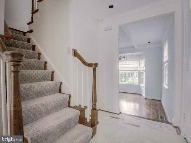 stairway with crown molding