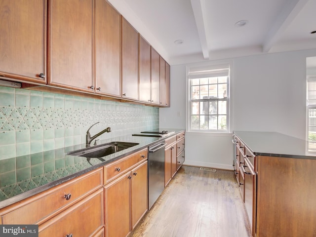 kitchen with sink, dishwasher, beam ceiling, light hardwood / wood-style floors, and decorative backsplash