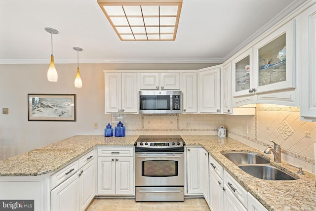 kitchen with white cabinetry, sink, pendant lighting, and appliances with stainless steel finishes