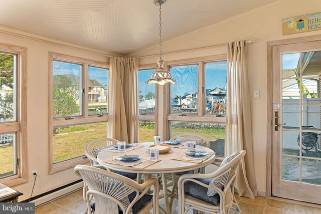 sunroom / solarium featuring an inviting chandelier, a baseboard radiator, and lofted ceiling