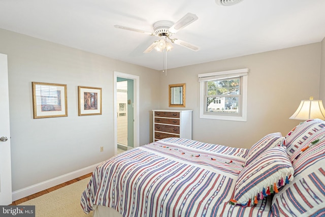 bedroom featuring ceiling fan and wood-type flooring