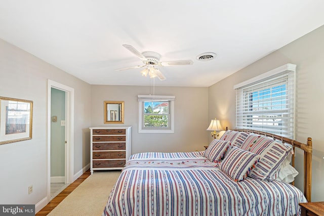 bedroom featuring ceiling fan and light hardwood / wood-style flooring