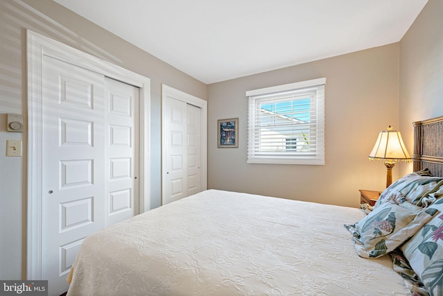 bedroom featuring multiple closets