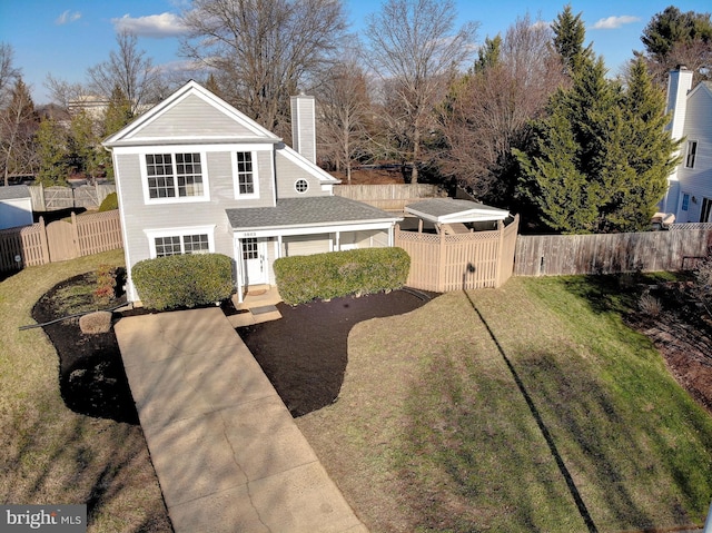 view of property with a carport and a front lawn