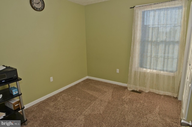 unfurnished room with carpet floors