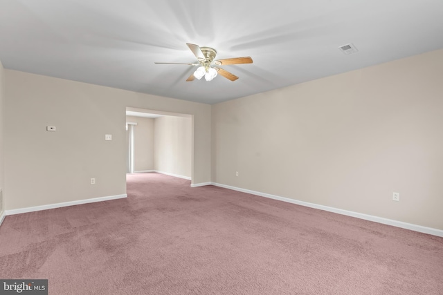 spare room with ceiling fan and carpet floors