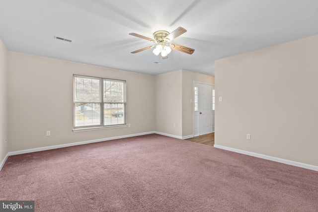 carpeted empty room with ceiling fan