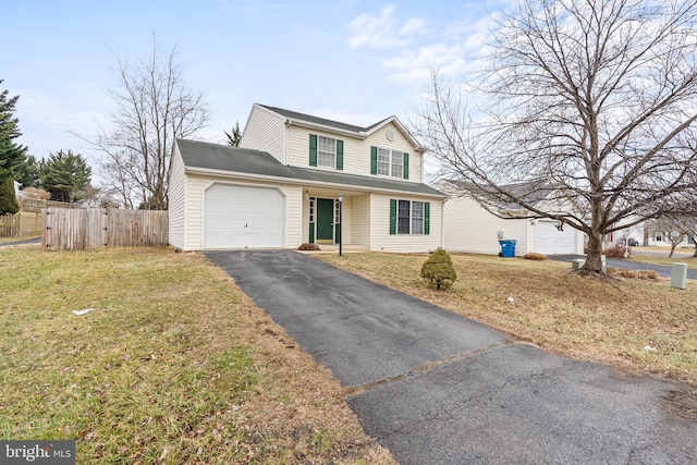 front facade featuring a garage and a front yard