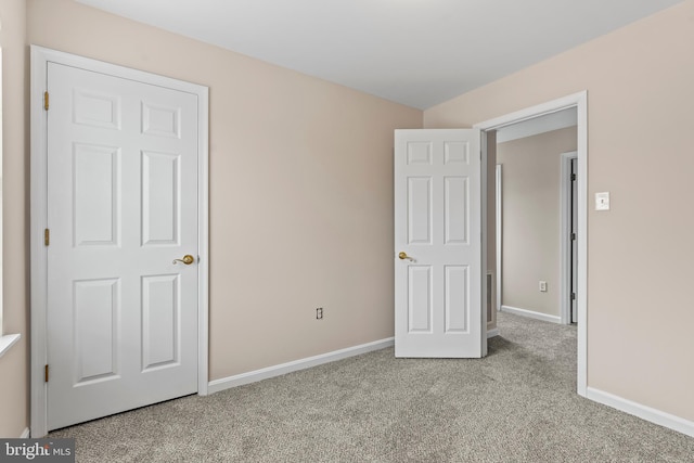 unfurnished bedroom with light carpet