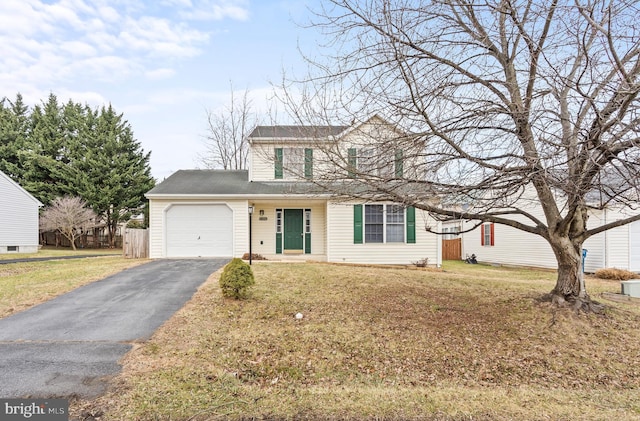 view of front property with a garage and a front lawn