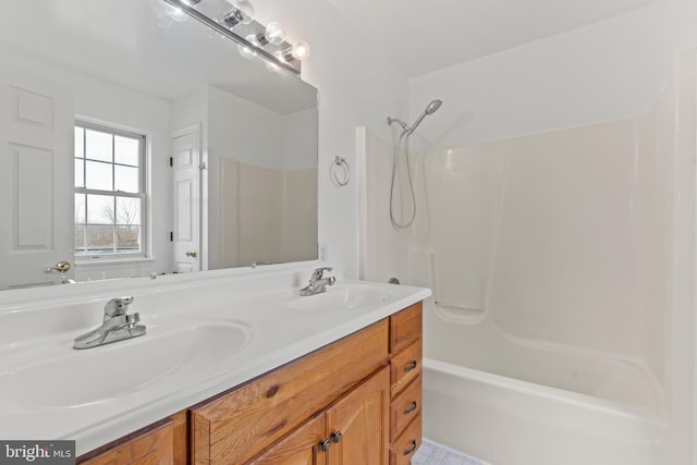 bathroom with shower / bathtub combination and vanity