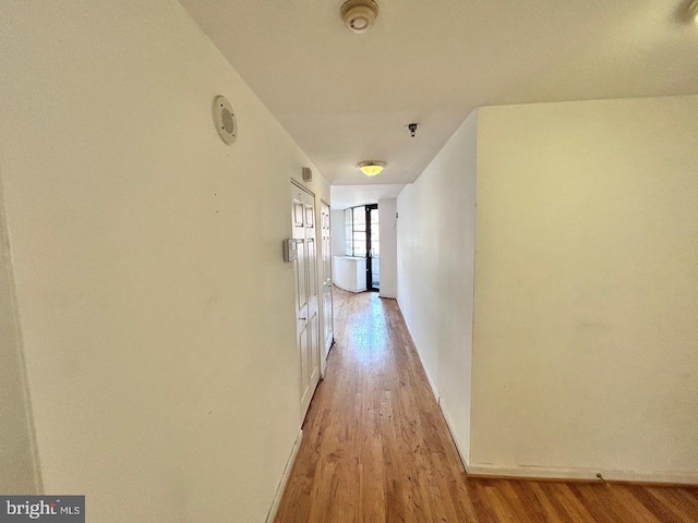 corridor featuring light hardwood / wood-style floors