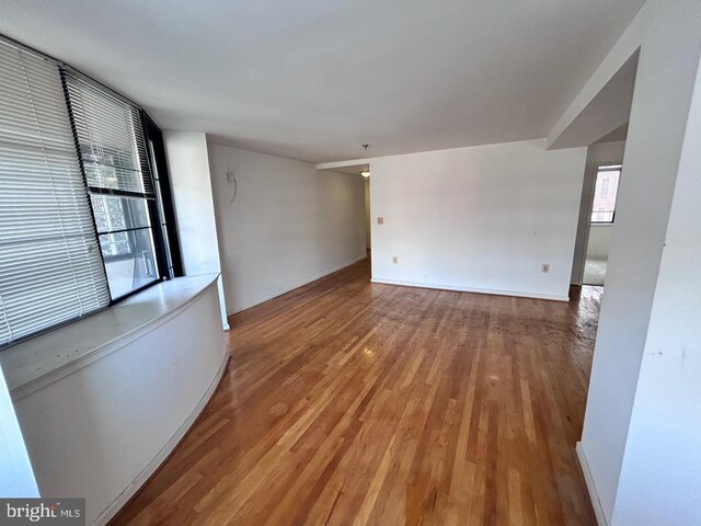 empty room featuring hardwood / wood-style flooring