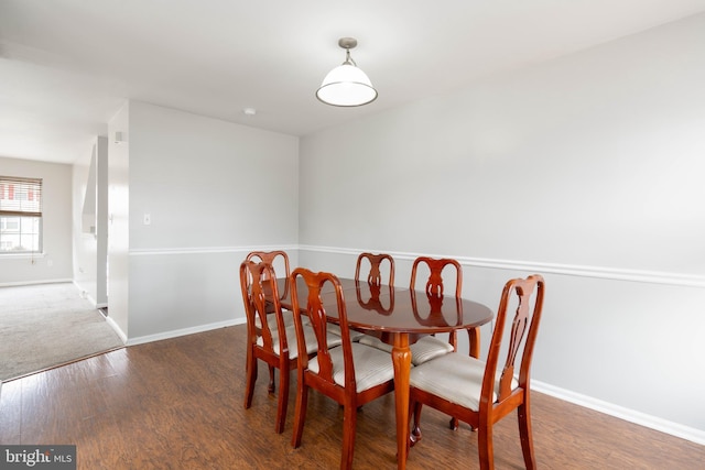 dining area featuring dark hardwood / wood-style flooring