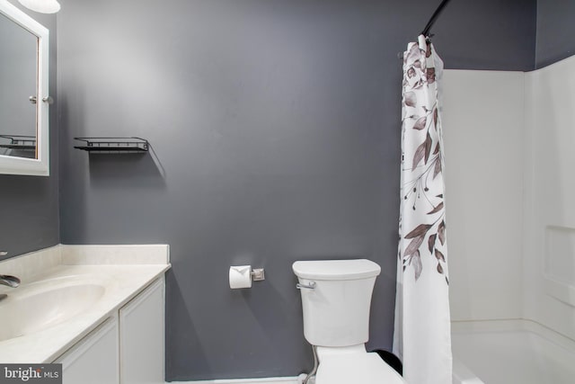 bathroom with vanity, a shower with curtain, and toilet