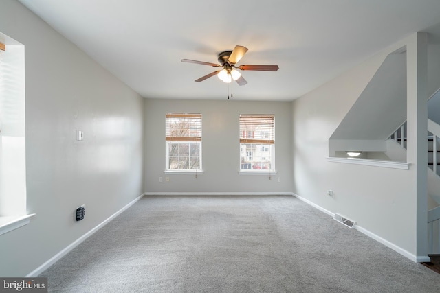 carpeted empty room with ceiling fan