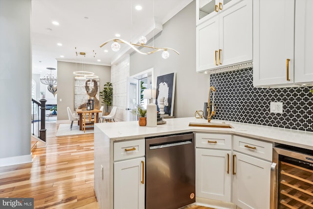 kitchen featuring decorative light fixtures, black dishwasher, white cabinets, wine cooler, and crown molding