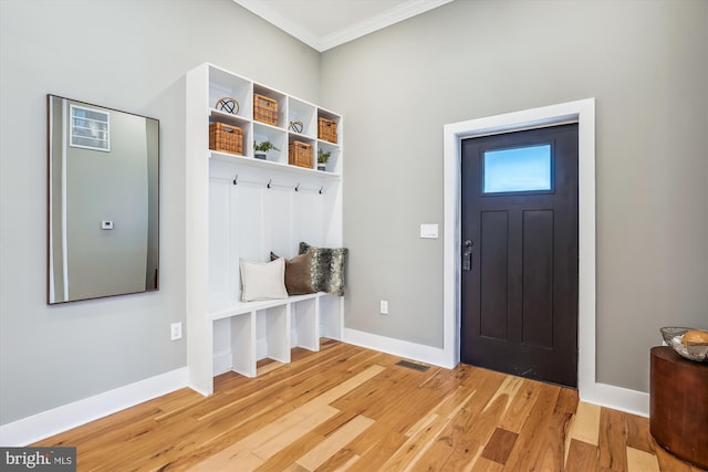 mudroom with crown molding and light wood-type flooring