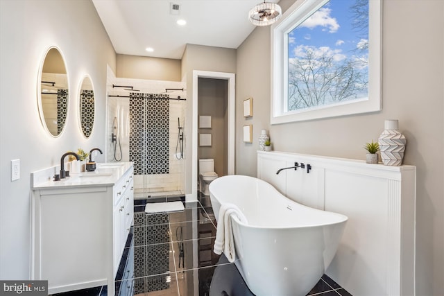 full bathroom with toilet, tile patterned floors, vanity, and shower with separate bathtub