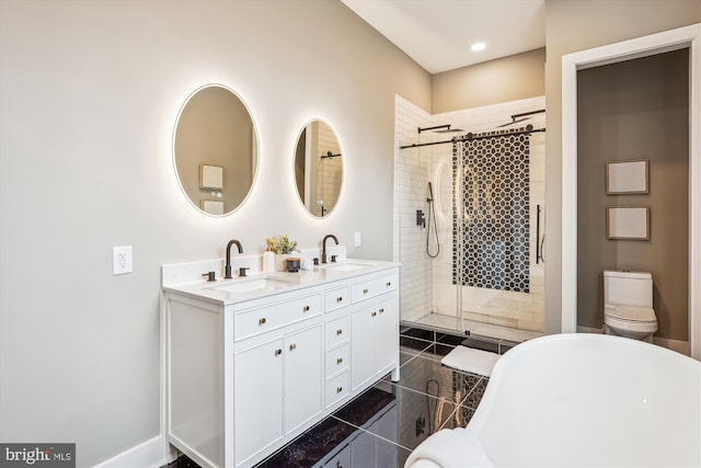 bathroom featuring vanity, tile patterned flooring, toilet, and walk in shower