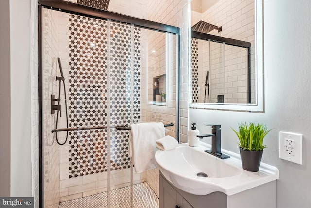 bathroom featuring vanity and an enclosed shower