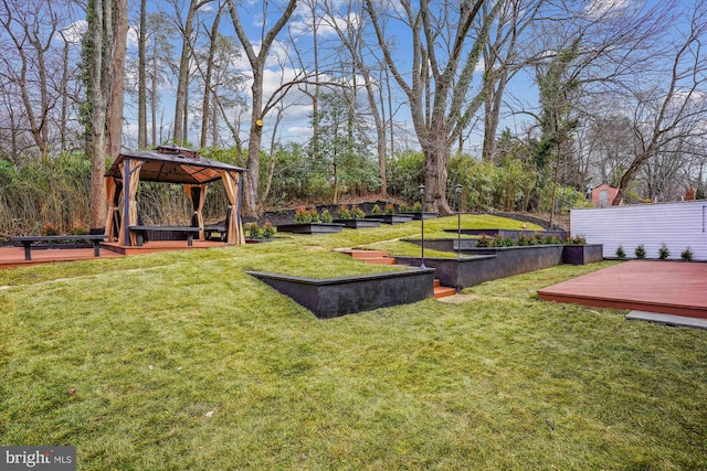 view of yard with a wooden deck and a gazebo