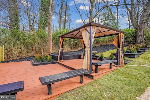 wooden deck with a gazebo and a lawn