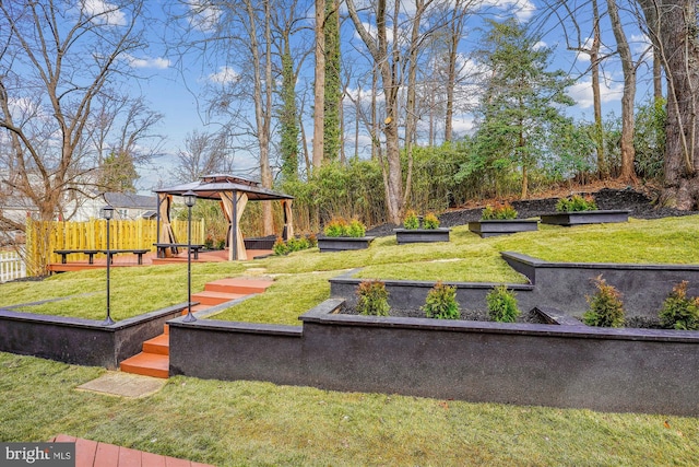 view of property's community with a gazebo and a lawn